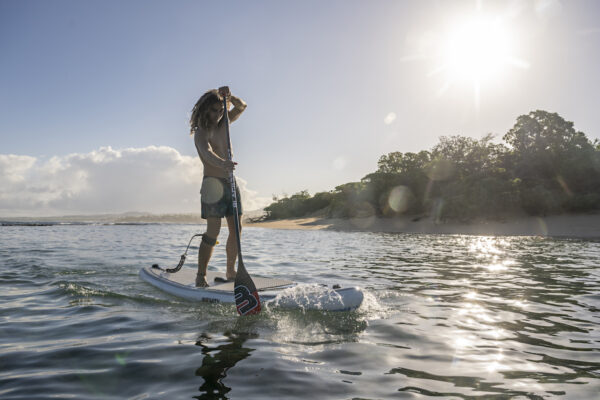 Bernd Roediger uses a Black Project Pure, a beginner SUP paddle, while paddle boarding in Maui.