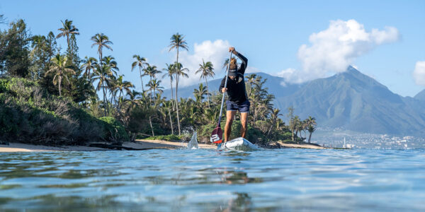 Bernd Roediger on an Infinity BlackFish paddle board on Maui with a Black Project PowerGrip SUP Handle.