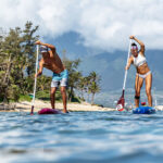 Arthur Arutkin and Seychelle Webster standup paddling with new 2022 SUP paddles from Black Project.