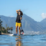 Bernd Roediger paddle boarding on a Infinity Blackfish and using a Black Project Hydro TempoX SUP flatwater paddle.