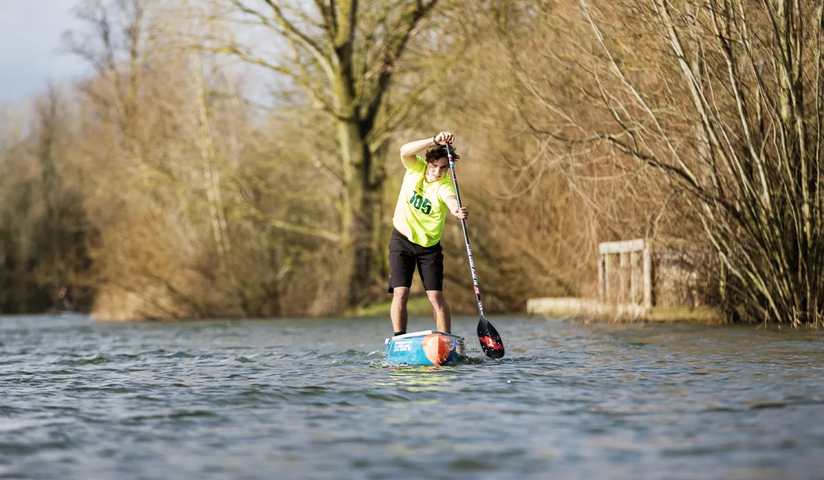 Hector Jessel paddling at Bray Lake Watersports with the Hydro SynergyX Sup race paddle by Black Project.