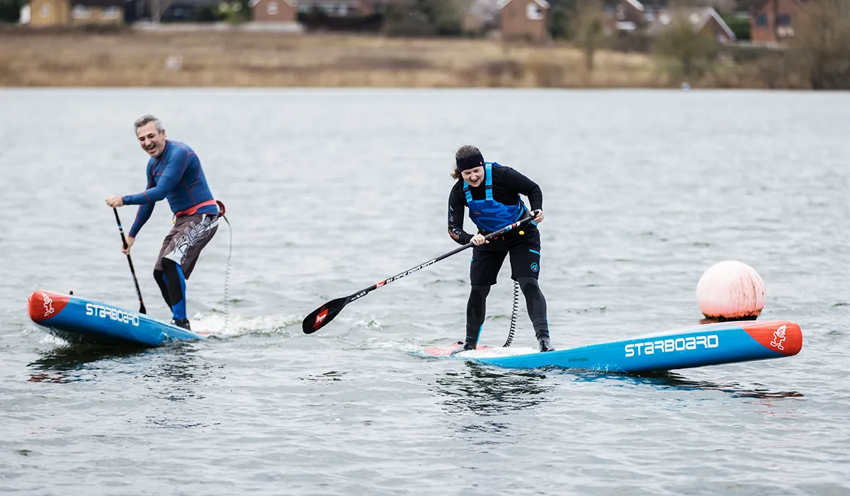 Standup paddlers trying out the Hydro SynergyX SUP race paddle at Bray Lake during the Black Project Synergy Tour.